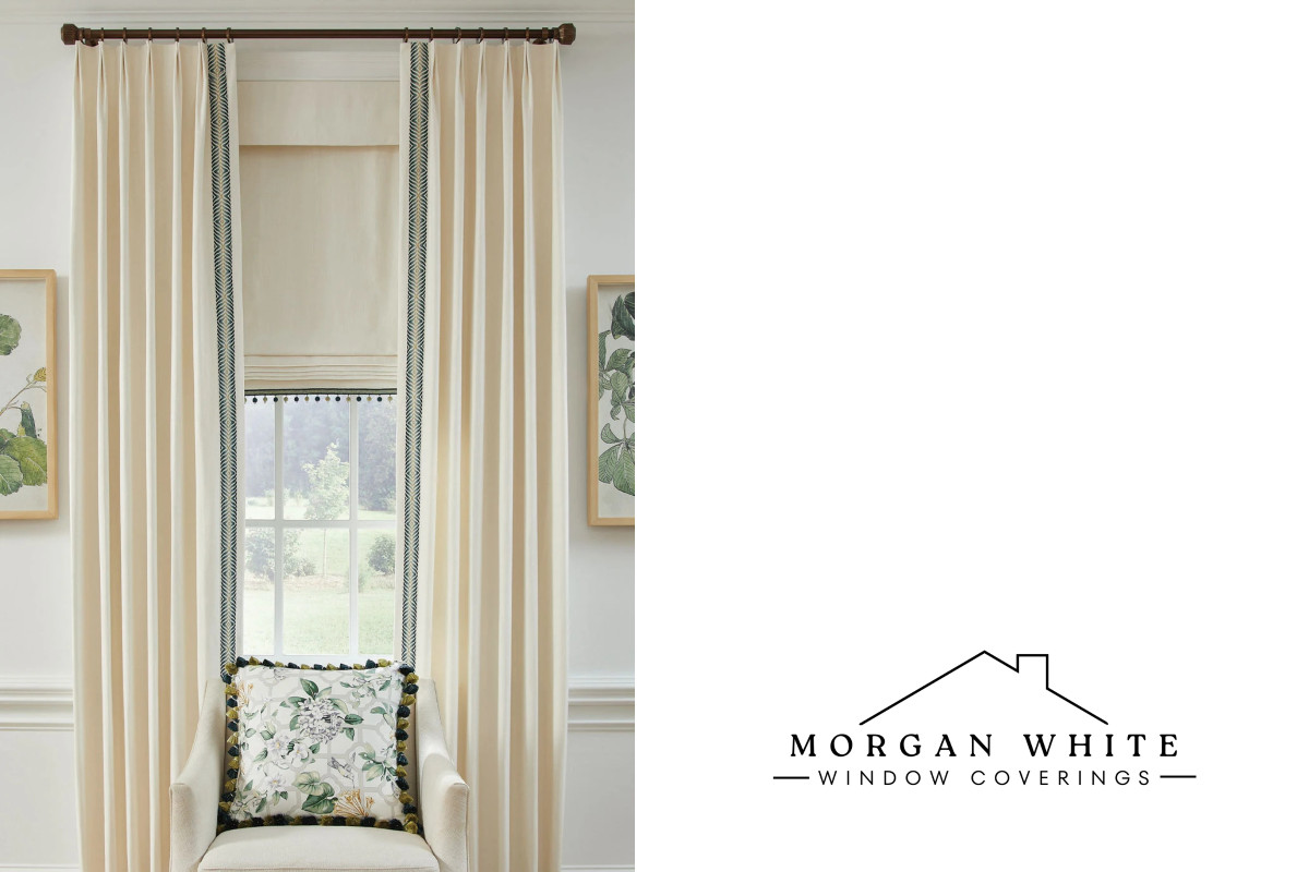 Custom drapery in the bedroom layered with Roman shades.